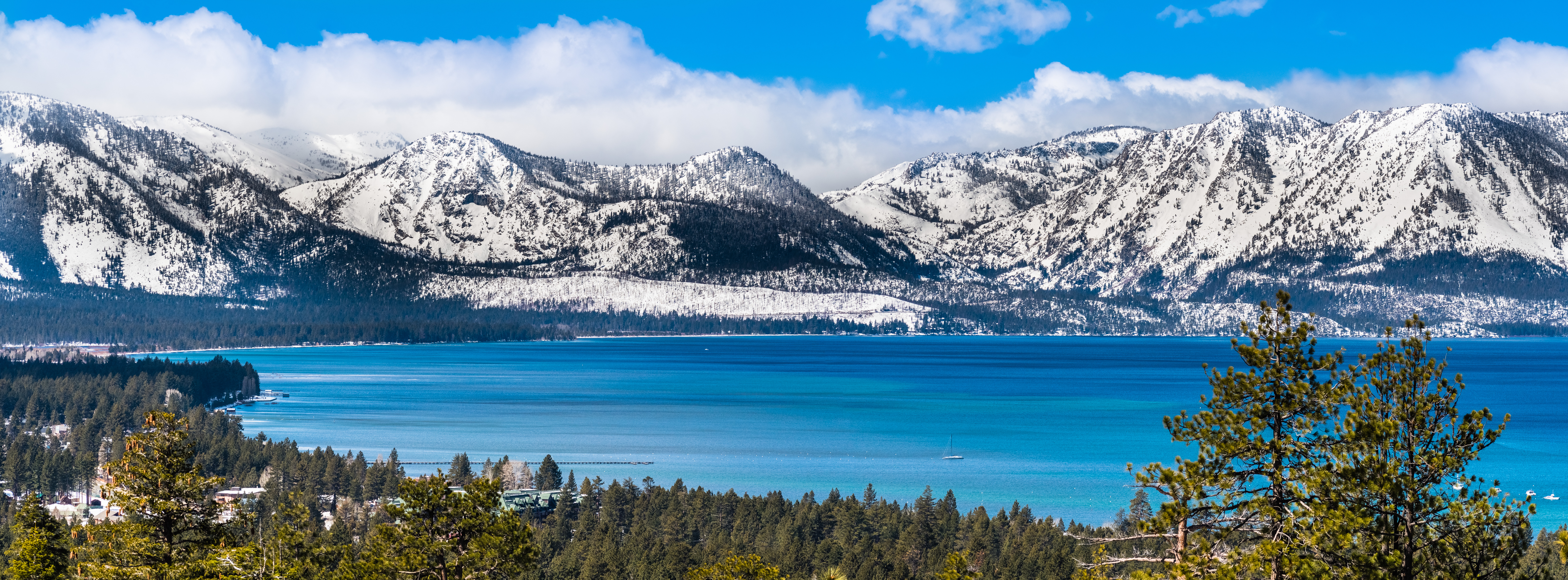 Panoramic view towards Lake Tahoe on a sunny clear day; the snow