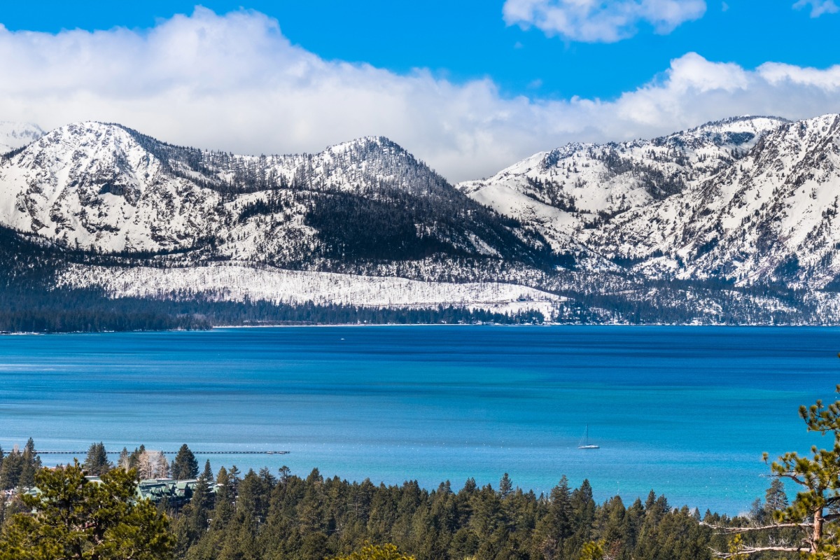 Panoramic view towards Lake Tahoe on a sunny clear day; the snow